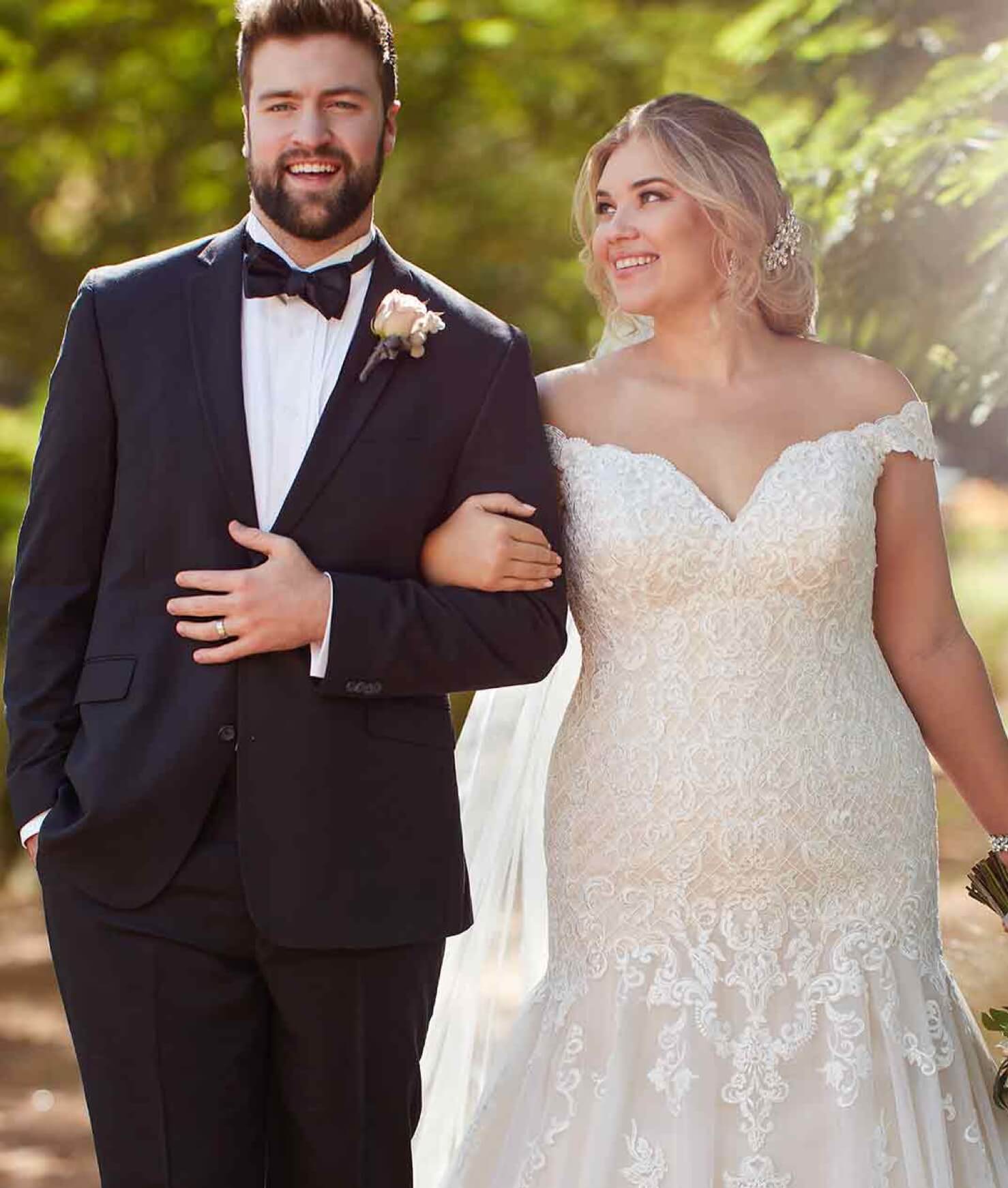 Plus size model in a white off-shoulder gown