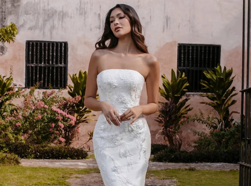 Model wearing white Disney Colection dress