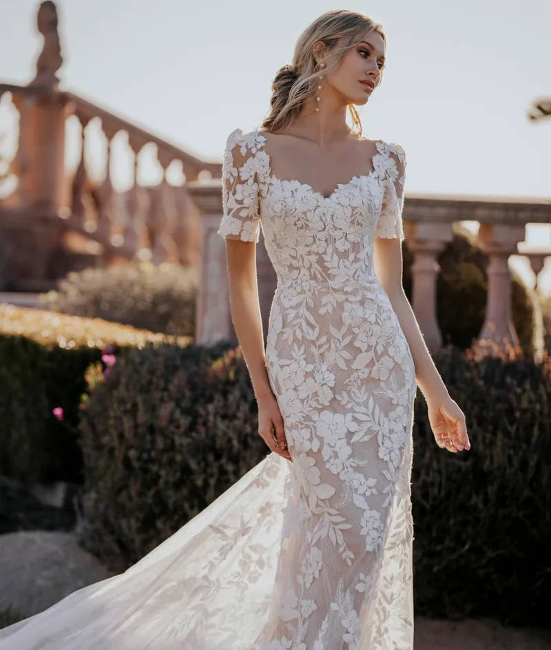 Model wearing white Allure Bridalwear dress