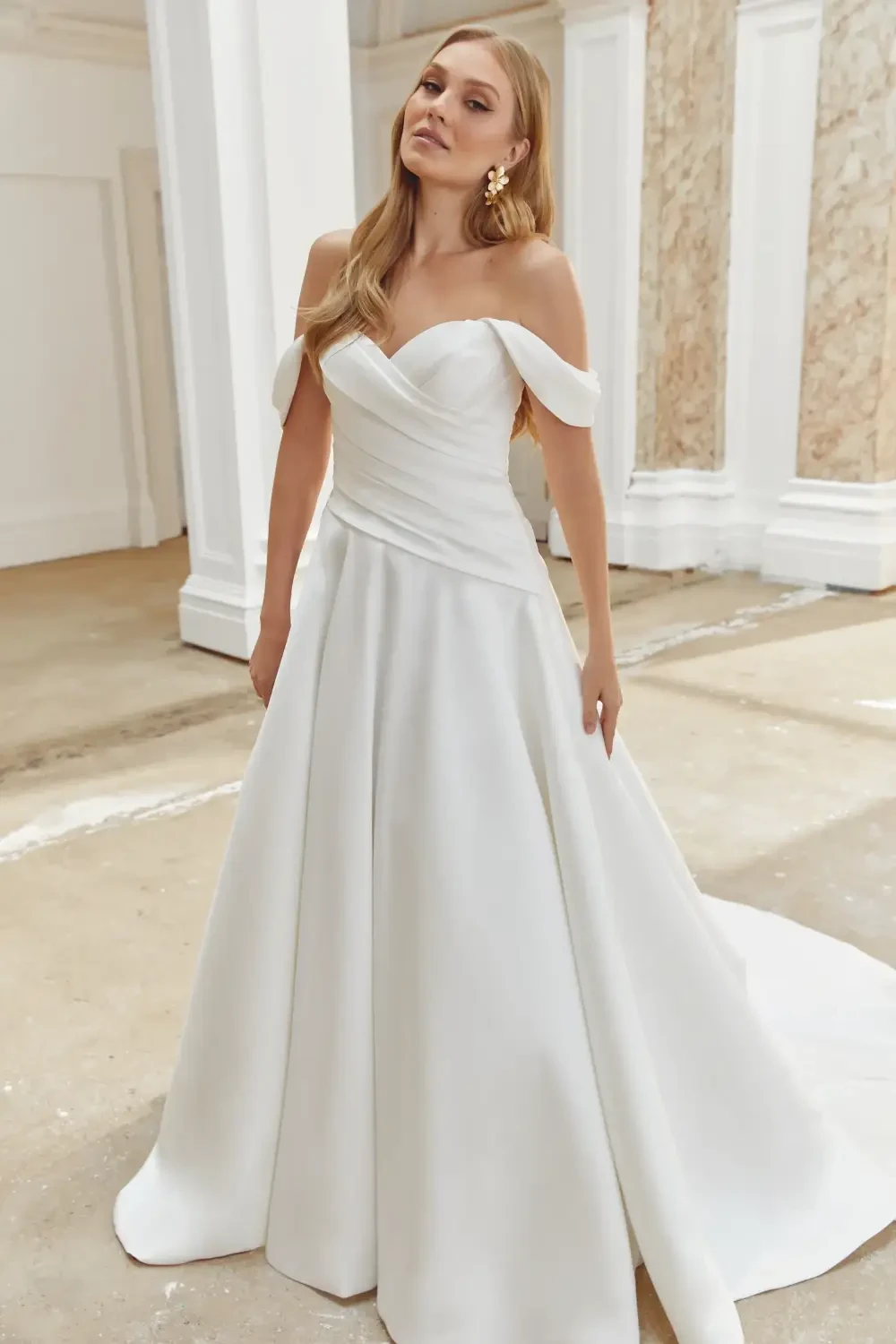 Model wearing white Sincerity Bridal gown